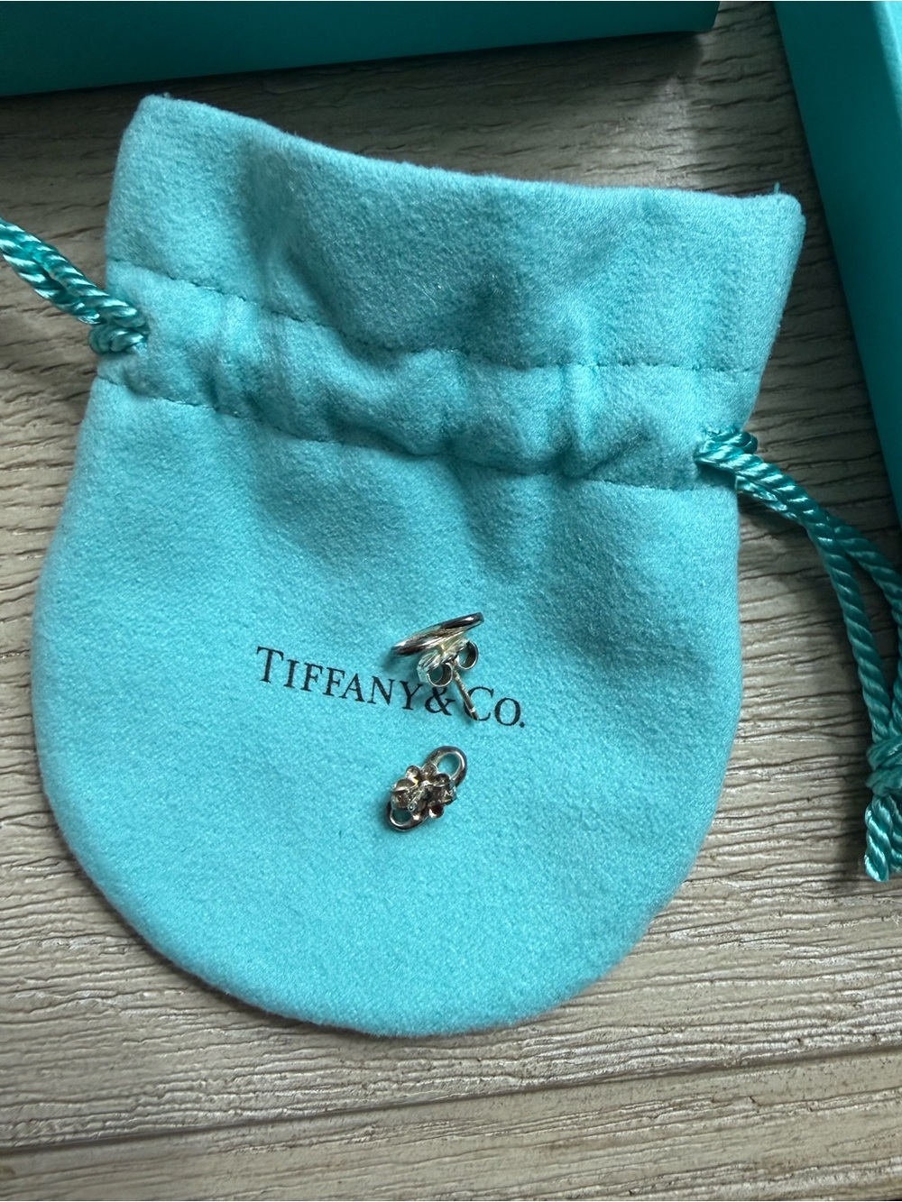 Tiffany & Co. Silver infinity studs with Signature Blue Pouch
